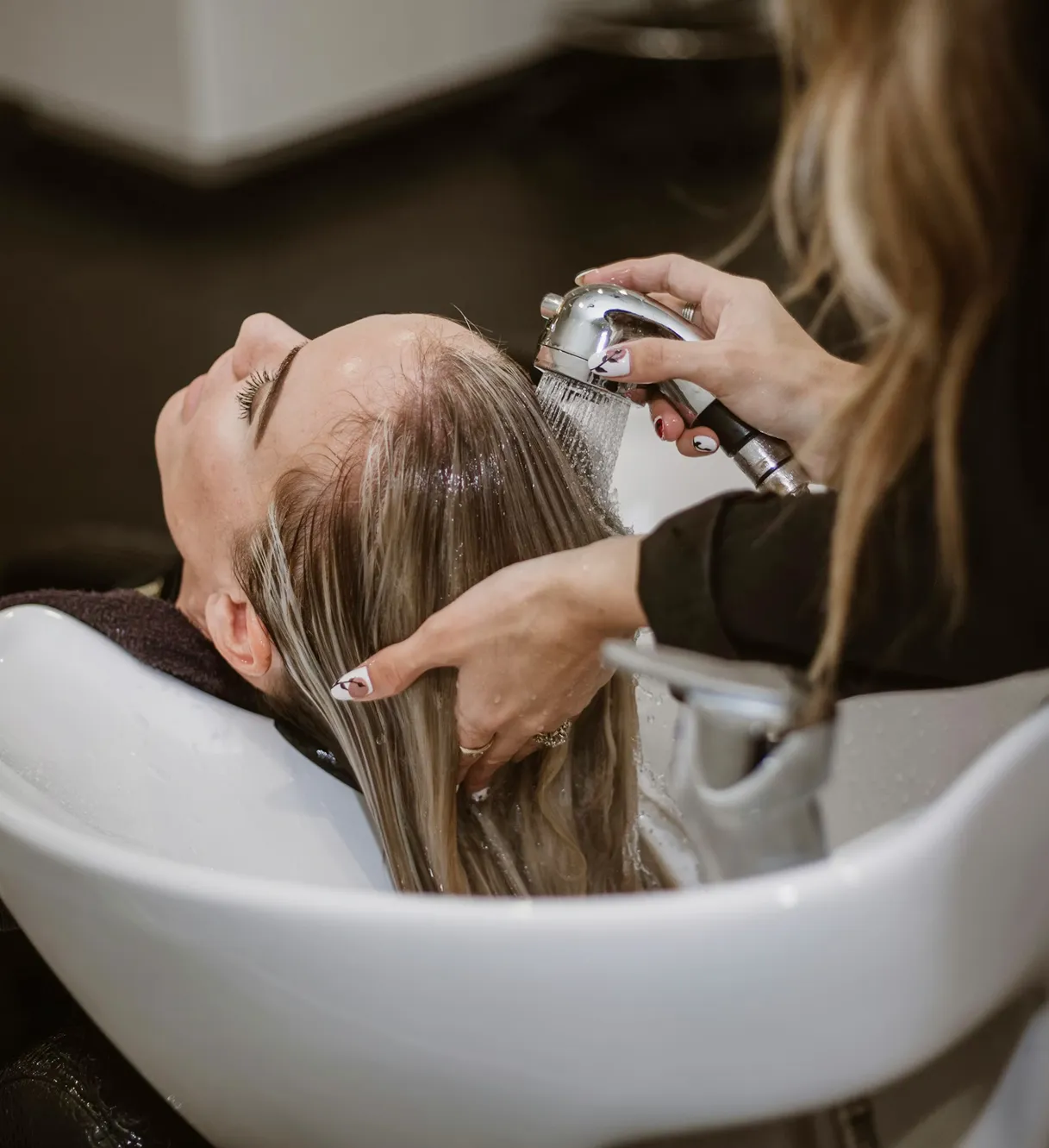 Hair treatment and wash at hair salon